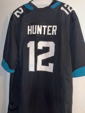Travis Hunter Black Football Jersey with White Number 12 and Teal Accents